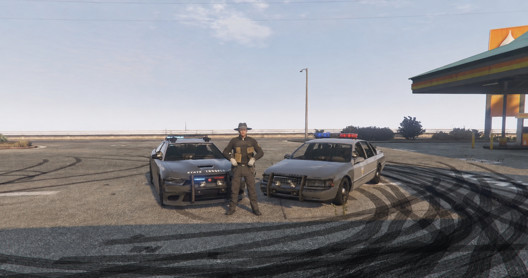 NMSP troopers and patrol cars at gas station